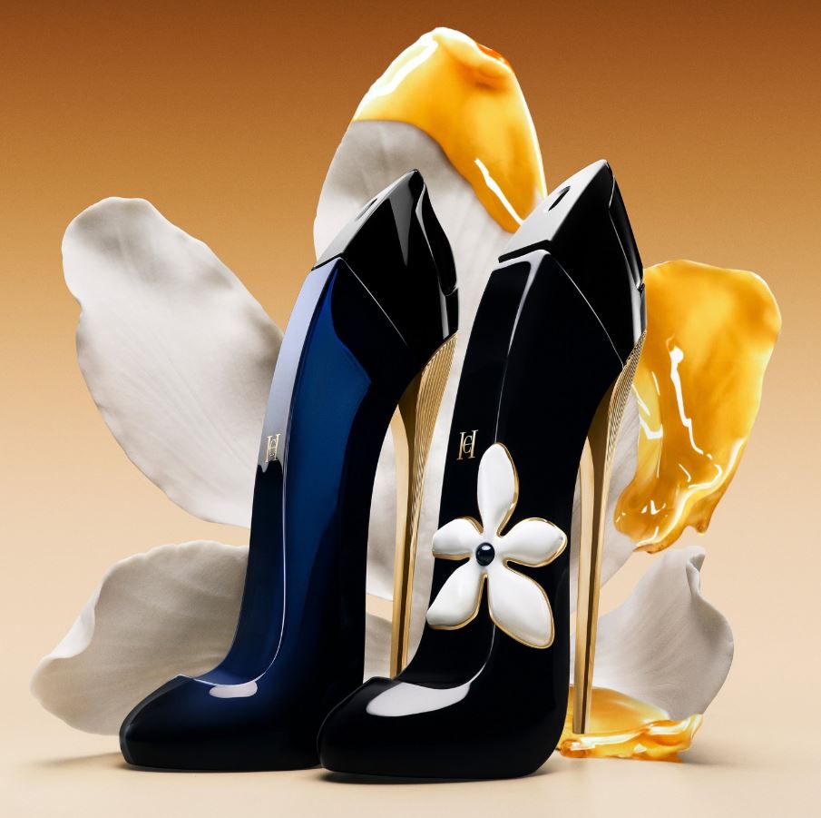 Black high-heeled shoes with white flower design and yellow accents on a beige background