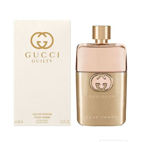 Gucci Guilty perfume bottle and packaging on a white background