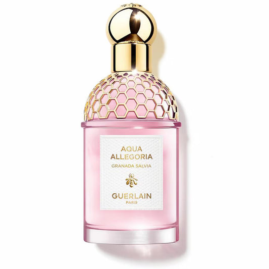 Pink Guerlain perfume bottle with gold cap on a white background