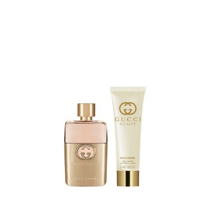 Gucci perfume bottle and body lotion on a white background