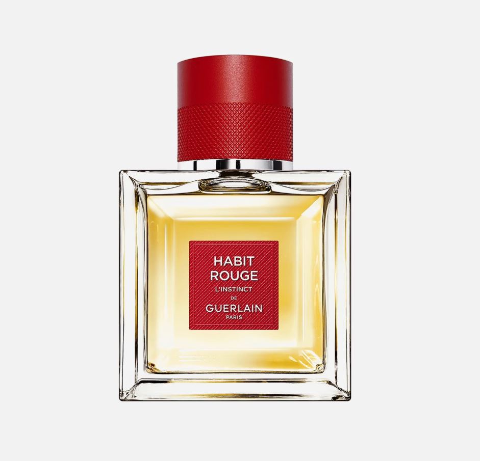 Perfume bottle with red cap and label on a white background