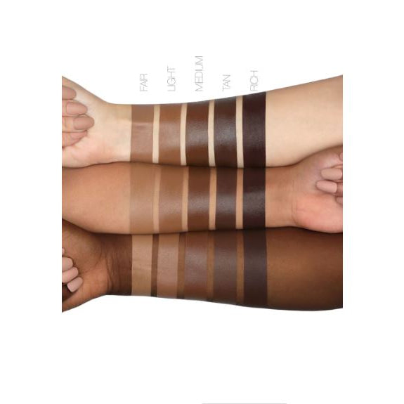 Color swatches on a person's arm with different shades of brown.