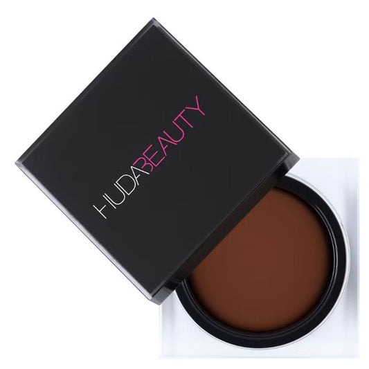 Huda Beauty brown compact powder on a white background