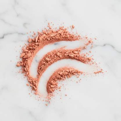 Rodial Blush Drops Velvet Peach powder texture close up — rose peach coral #FF917D on marble