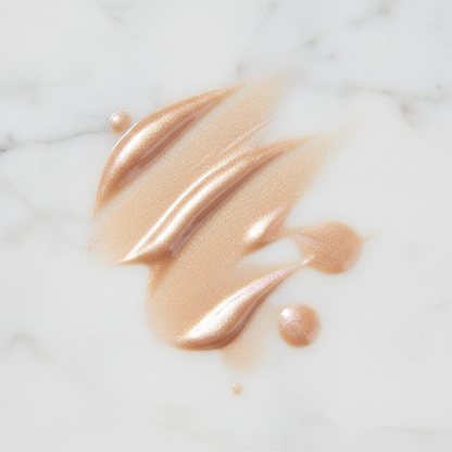 Rodial Glass Illuminating Liquid Highlighter – champagne golden shimmer texture swatch