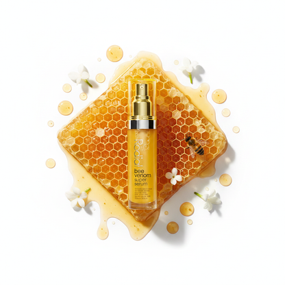 Rodial Bee Venom Nourishing Face Serum 30ml flat lay with honeycomb and amber honey drops