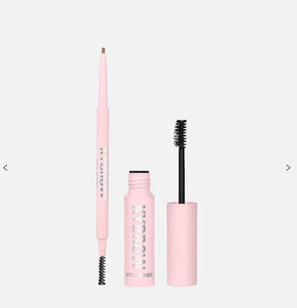 Pink makeup set with an eyebrow pencil and mascara on a white background