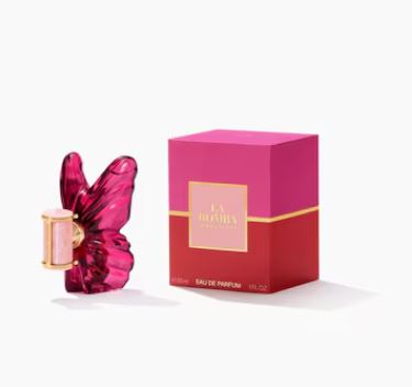 Pink perfume bottle with butterfly design and matching box on a white background