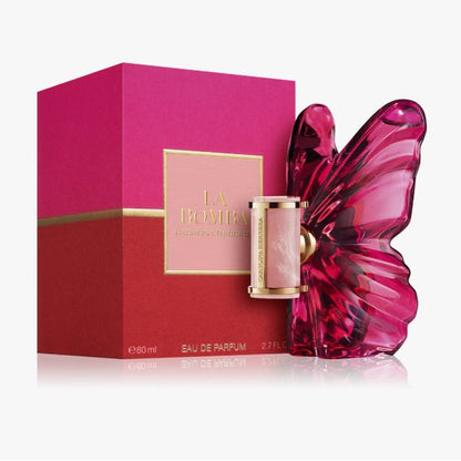 Pink butterfly-shaped perfume bottle with matching box on a white background