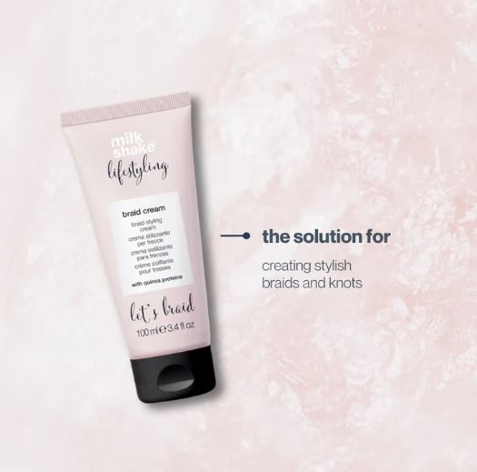 Tube of milk_shake styling braid cream on a pink textured background