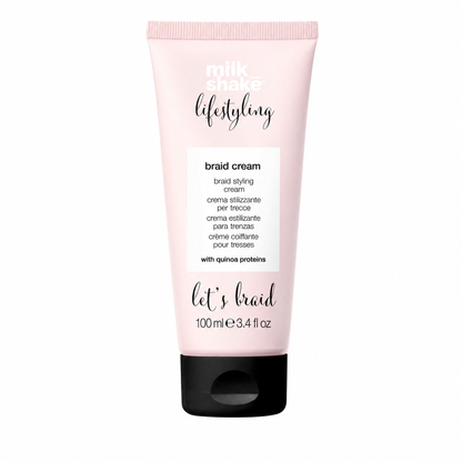 Pink tube of milk_shake styling braid cream on a white background