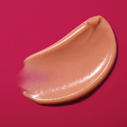 Beige makeup swatch on a pink background