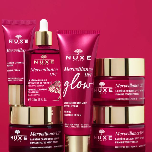 Nuxe skincare products on a pink background