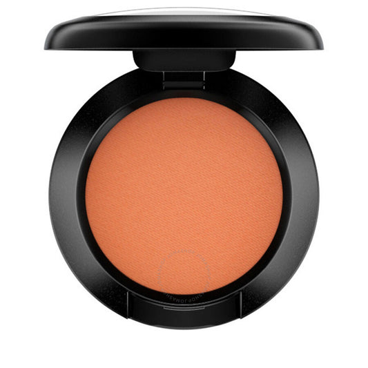 Compact orange blush in a black case on a white background