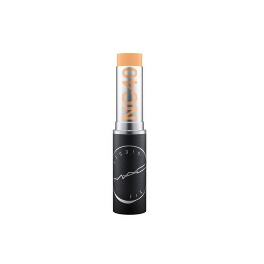 Makeup stick with beige cap and black body on a white background