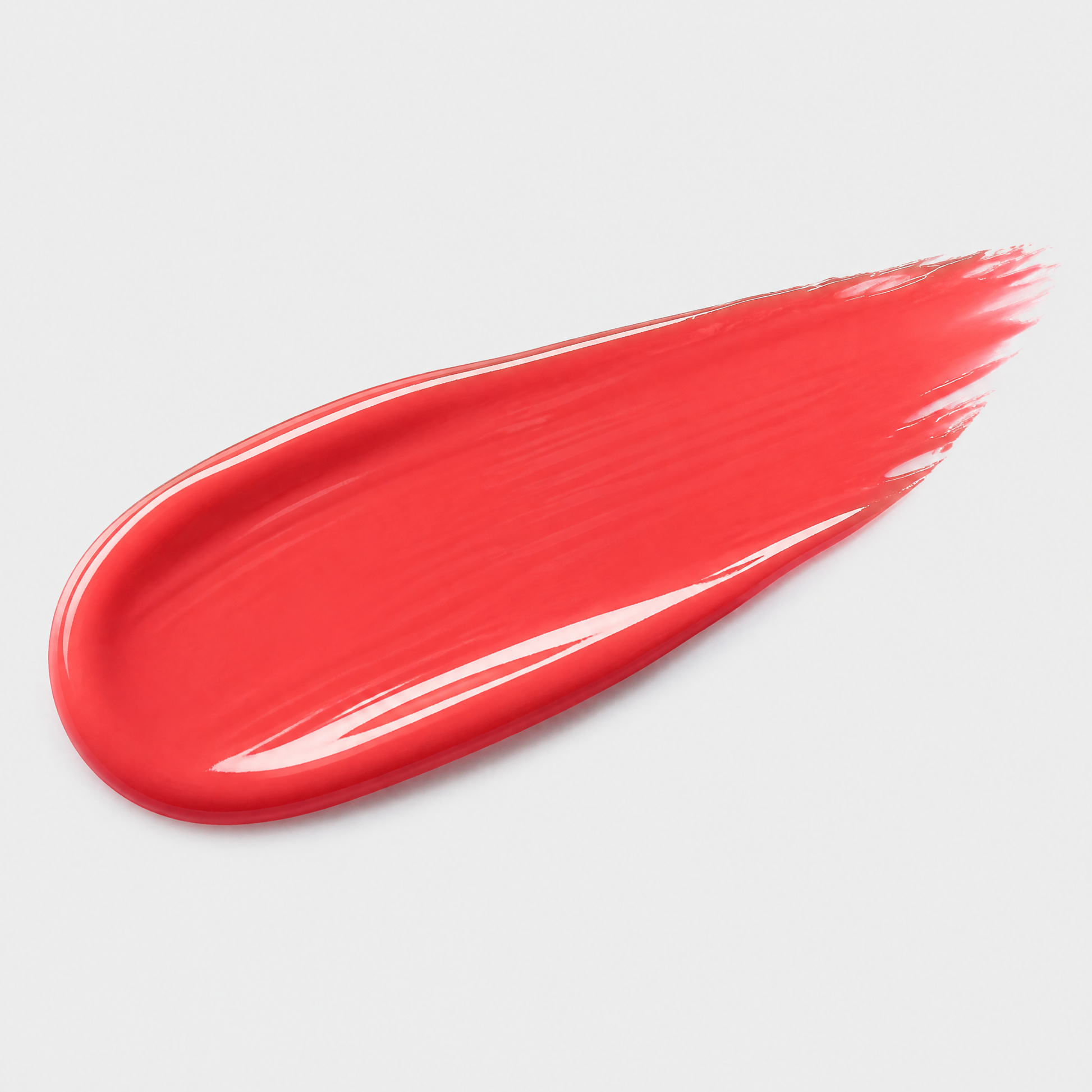 Red lipstick swatch on a light gray background