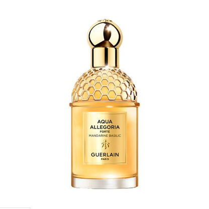 Guerlain perfume bottle with gold cap on a white background