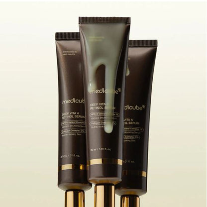 Three tubes of Medicube Deep Vita A Retinol Serum on a beige background