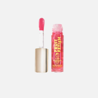 Pink lip gloss with applicator on a white background