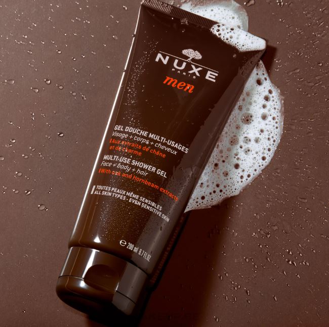 Nuxe men's multi-use shower gel on a brown background