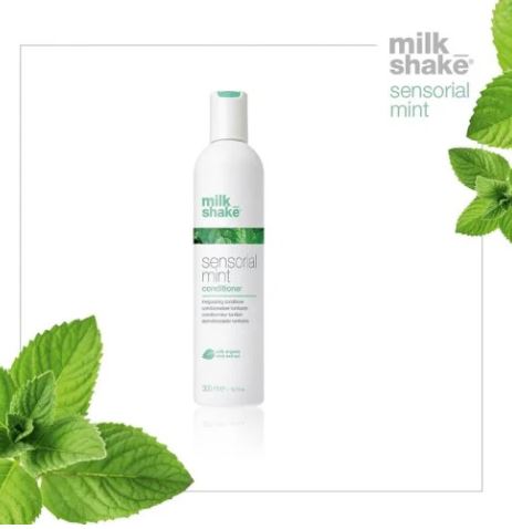 Milk Shake Sensory Mint conditioner bottle with mint leaves on a white background