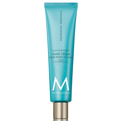 Blue hand cream tube with gold cap on a white background