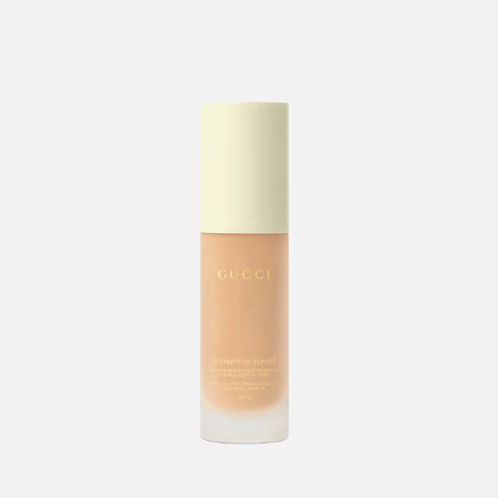 Gucci foundation bottle on a light gray background
