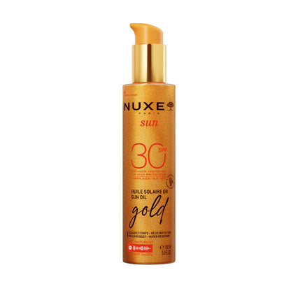 Nuxe sun oil gold bottle on a white background