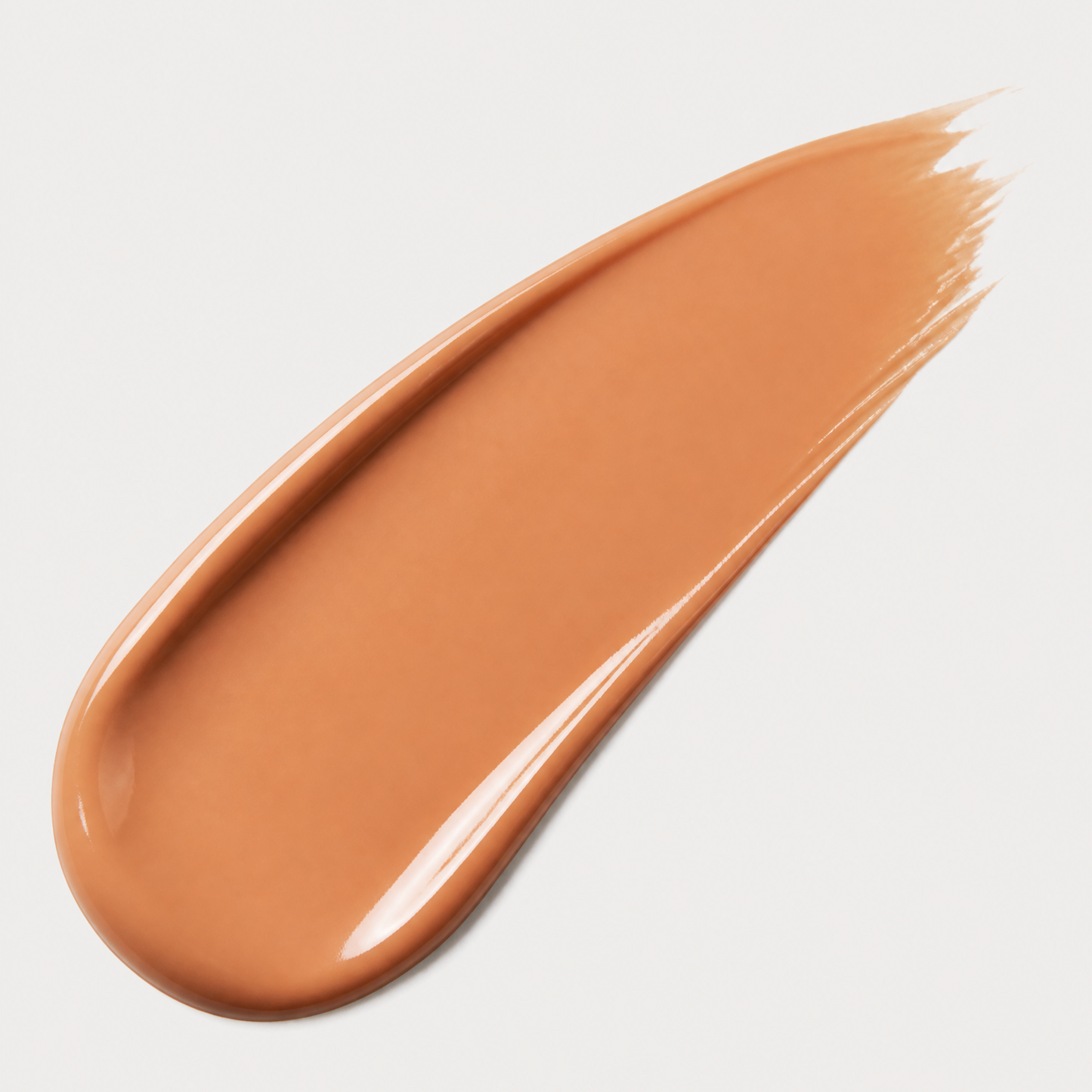 Brown makeup swatch on a light gray background