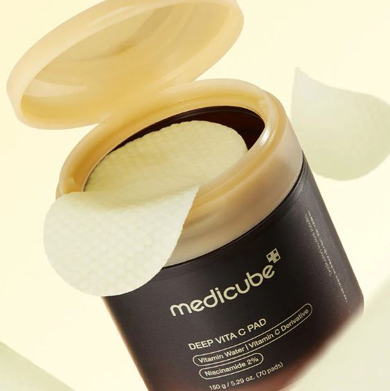 Open container of Medicube Deep Vita C Pad on a light background