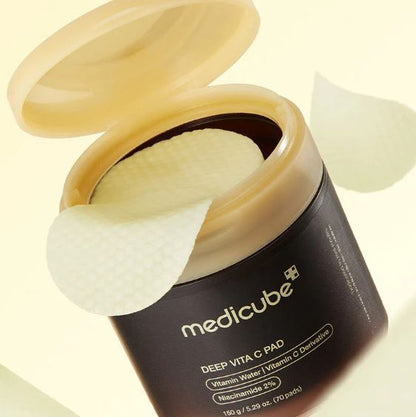 Open container of Medicube Deep Vita C Pad on a light background