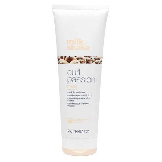 Tube of 'curl passion' hair mask by milk makeup on a white background
