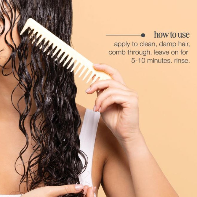 Person using a white comb on wet hair with instructions on a beige background
