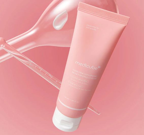 Pink tube of MediCube cream on a pink background