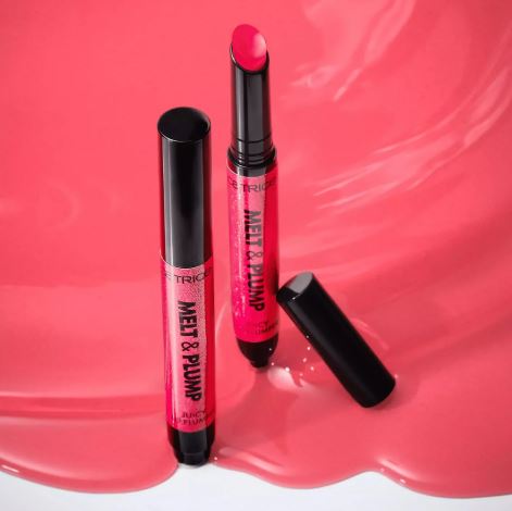 Pink lip balm with black cap on a pink background