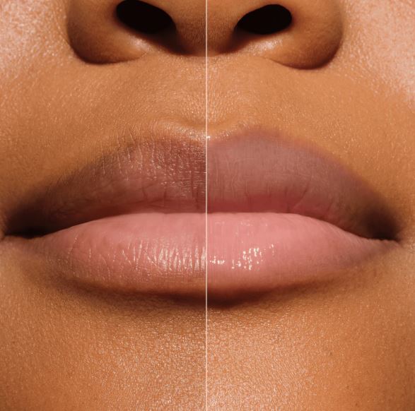 Close-up of a person's lips with a clear lip balm on one side and a glossy lip balm on the other, on a neutral background.