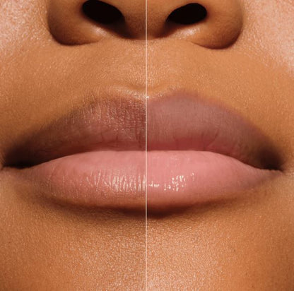 Close-up of a person's lips with a clear lip balm on one side and a glossy lip balm on the other, on a neutral background.