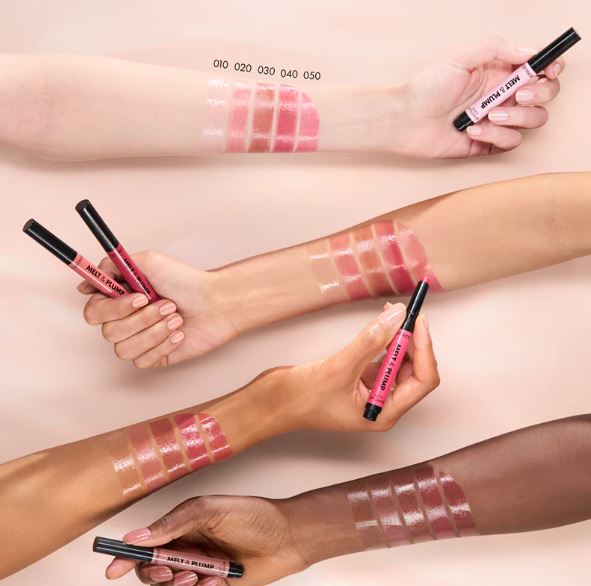 Lip gloss swatches on arms with different shades held by hands