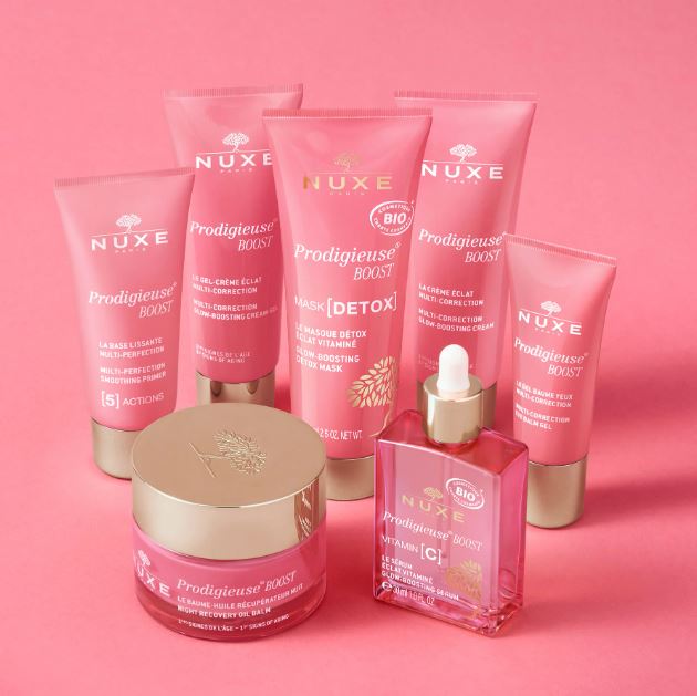 Nuxe skincare products on a pink background