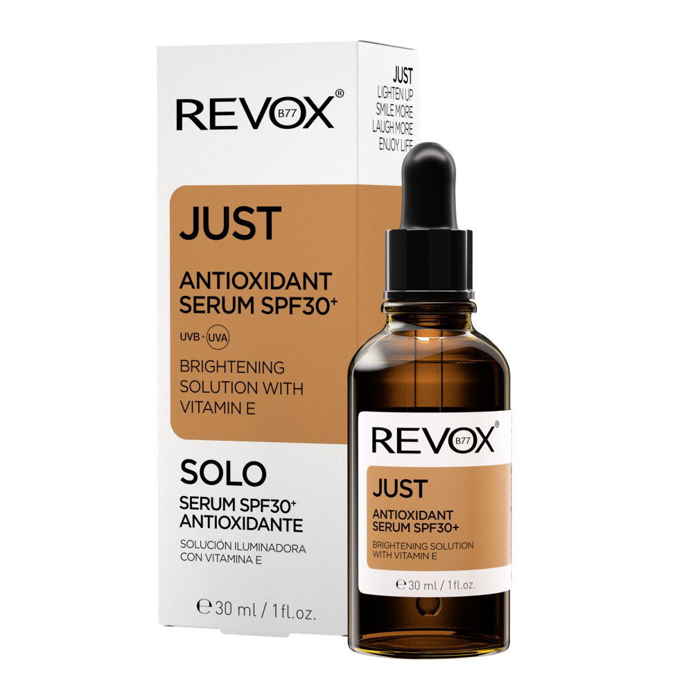 REVOX JUST Antioxidant Serum SPF 30+ in a 30 ml amber glass dropper bottle, shown next to its white and brown cardboard packaging box on a plain white background.