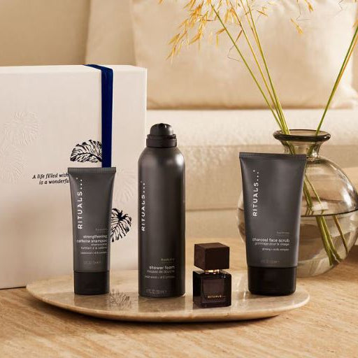 Rituals skincare products on a marble tray with a beige background
