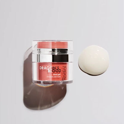 Cosmetic jar labeled 'Dragon's Blood' with a white sphere on a light gray background