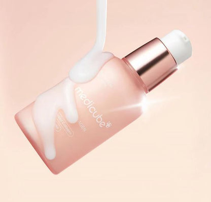 Skincare product with a pink bottle and white cap on a light pink background