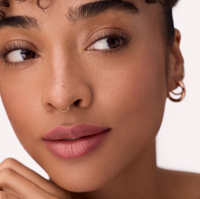 Close-up of a woman's face with a neutral background