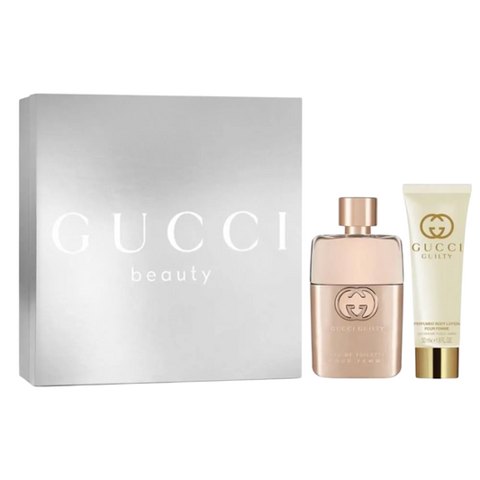 Gucci beauty product set with a box, perfume bottle, and cream tube on a white background