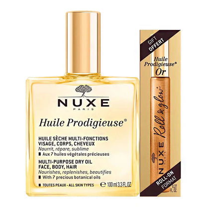 Nuxe Huile Prodigieuse multi-purpose dry oil with a smaller roll-on bottle in the background on a white background