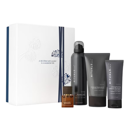 Rituals men's grooming product set including a bottle, scrub, and other items on a white background.