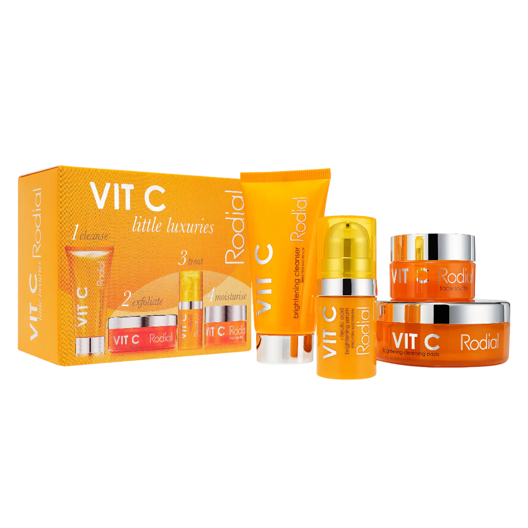 Radiant skincare product set with orange and silver packaging on a white background