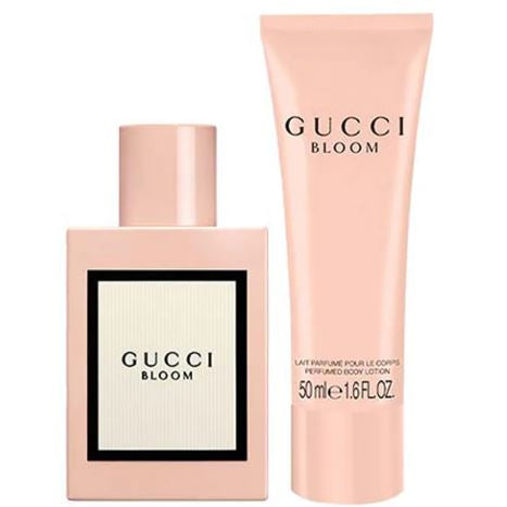 Gucci Bloom perfume bottle and body lotion on a white background