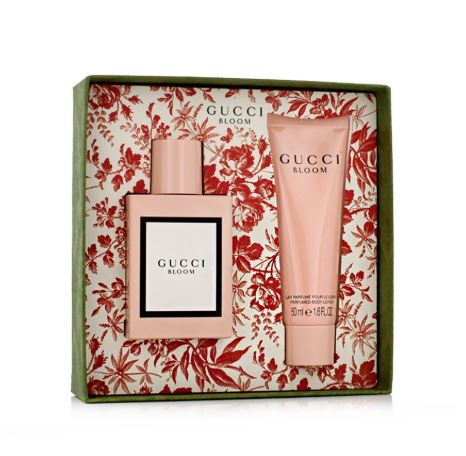 Gucci Bloom perfume set with floral packaging on a white background